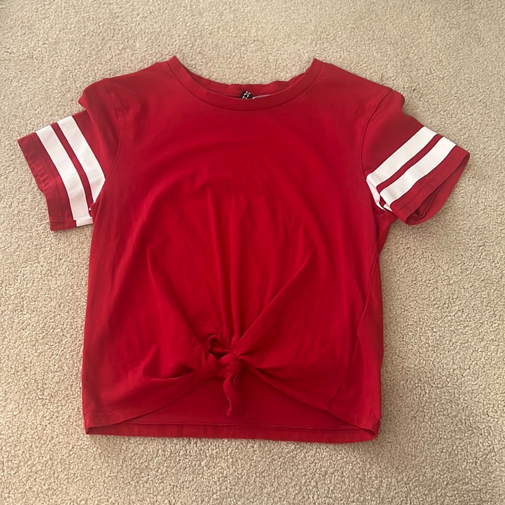 Lightly used H&M Divided US S Red Tee w/ White Stripes ties at the bottom